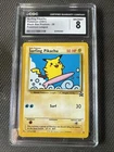 Pokemon 2001 Black Star League #28 Surfing Pikachu CGC 8 NM/Mint Vintage Card