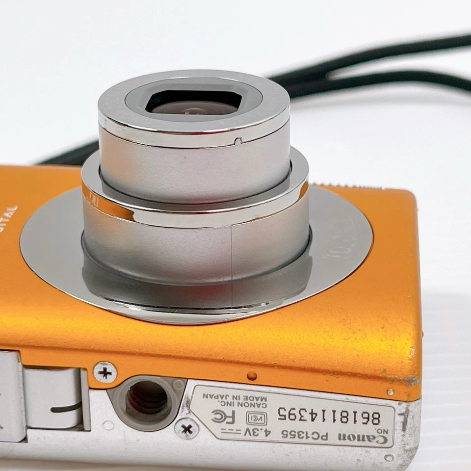 Restaurada Excelente+ Cámara Compacta Canon IXY Digital 110 IS Naranja Probada Foto 4 de 4