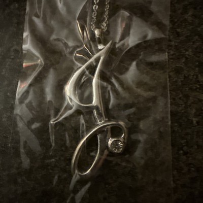 Farsi alphabet necklace with a pendant that has a script letter on an 18 1/2-in