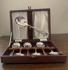 A vintage cased 7 piece set of bright electro-plated nickel silver fruit spoons