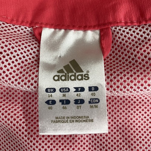 Chaqueta cortavientos mediana Adidas para mujer con cremallera completa cuello simulado ventilado salmón rosa - Imagen 7 de 11
