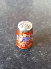 ANTIQUE STERLING SILVER AND ORANGE FLORAL ENAMEL THIMBLE