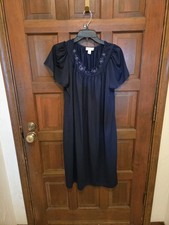 Miss Elaine Classics navy blue nylon nightgown features short flutter sleeves...
