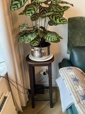 Wooden antique bar stool in brown wood