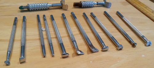 CRAFTOOL CO. USA LEATHER TOOL STAMPS SET OF 14 pieces . good used condition