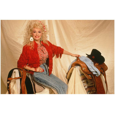Dolly Parton in Orange Fringe Jacket and Saddle x 10 inch photo