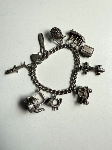 VINTAGE FINE SILVER CHARM BRACELET. 9 CHARMS. SHARK, RACING CAR. 49.9 GRAMS