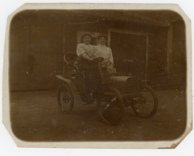 PHOTO CARD circa 1900, two women in an old car tacot