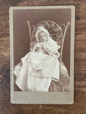 Vintage Cabinet Card. Baby in Chair w fur rug. D. Bangs in Sleepy Eye Minn