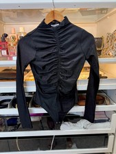 Good American black ruched bodysuit with long sleeves and high cowl neck