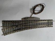 Fleischmann 6140.  One LH Turnout, gray.  One RH turnout, brown.  With Motors.