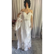 Elegant Lace Wedding Gown with Beaded Bodice and Dramatic Train