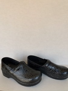 dansko black tooled leather clogs