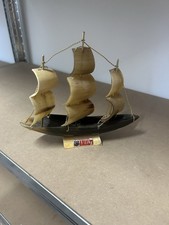 a vintage handcrafted nautical ship sculpture made from genuine cow horn