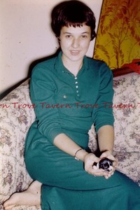 1950s Color Pretty Girl In Green With Bob Haircut Holds New Puppy