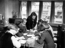 Roving teacher holds a class in living room of a house in Beckenha- Old Photo