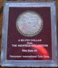 1897 Uncirculated Redfield Collection Morgan Silver Dollar in Red PICC Holder