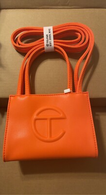 Small Orange Teflar bag. This item is new and still has all the tags. 