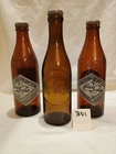 3 Vintage Coca Cola Commemorative Bottles. All 3 Sealed Empty With Lid
