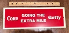 VINTAGE COKE / GETTY GOING THE EXTRA MILE SMALL SIGN 14 1/2 X 5 INCHES COCA COLA