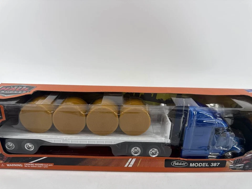 New Ray Peterbilt 387 Flatbed Truck w/ Hay Bales 1:43 Diecast - Image 2 of 4