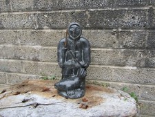 A wolf original carved statue - Made in Canada - man with seal - 25cm tall