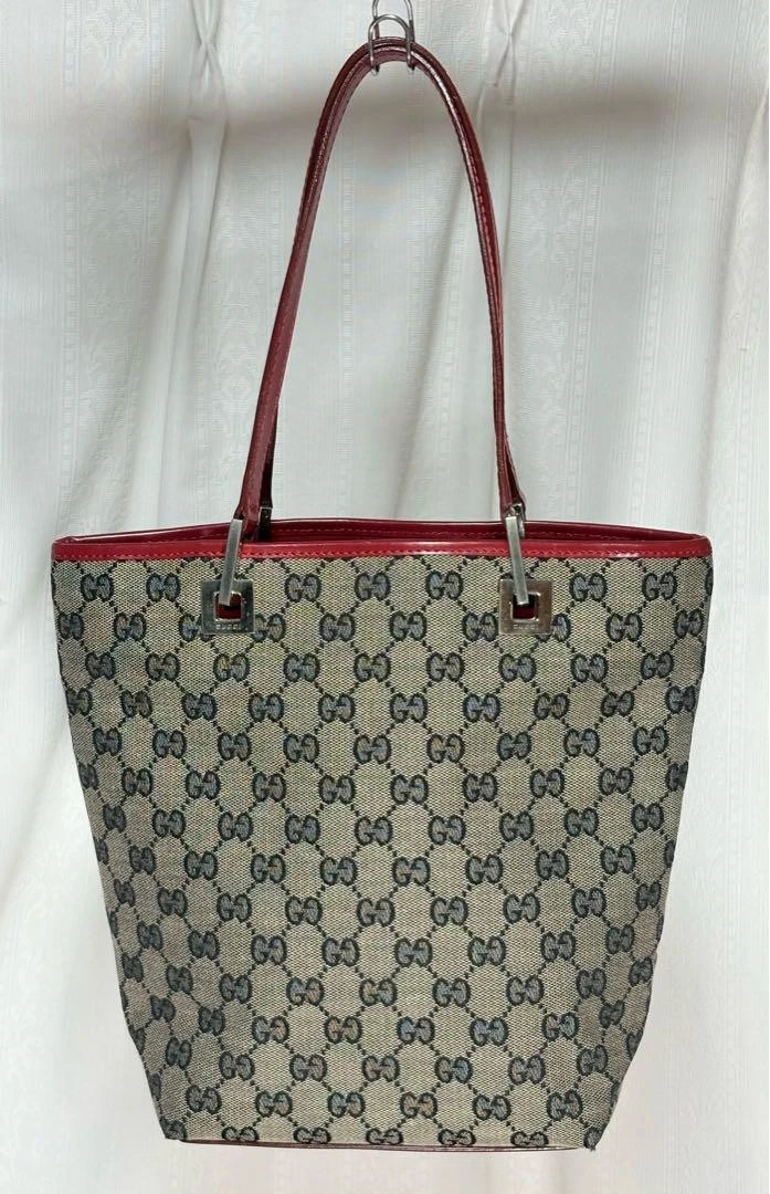Sac à main Gucci motif Gg 002 sac fourre tout créateur toile et cuir style iconique