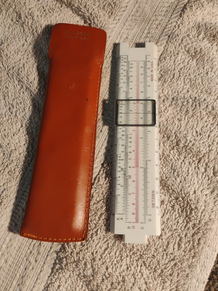 A pocket-sized 5" Dietzgen slide rule with leather sheath — small enough to carry, nerdy enough to impress any engineer or math teacher.