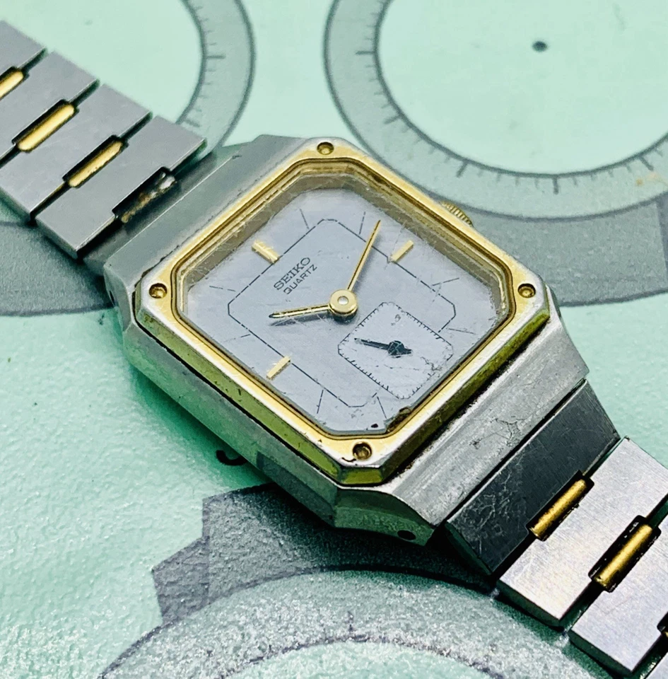 Reloj para mujer Seiko 1428-5089 tono plata/oro caja rectangular piezas/solo reparación Foto 2 de 4