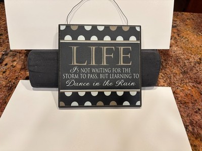 Life is Not Waiting for the Storm to Pass But Learning to Dance in the Rain Sign
