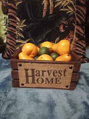 Hardest Home small decorative wood crate full of plastic fruit.