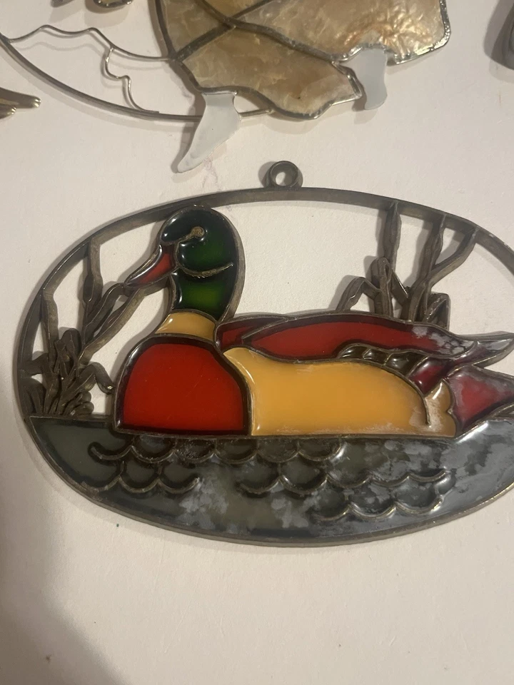 Atrapasoles de colección; John Deere, pato mallardo, ángeles abrazados, loro y linterna Foto 4 de 4