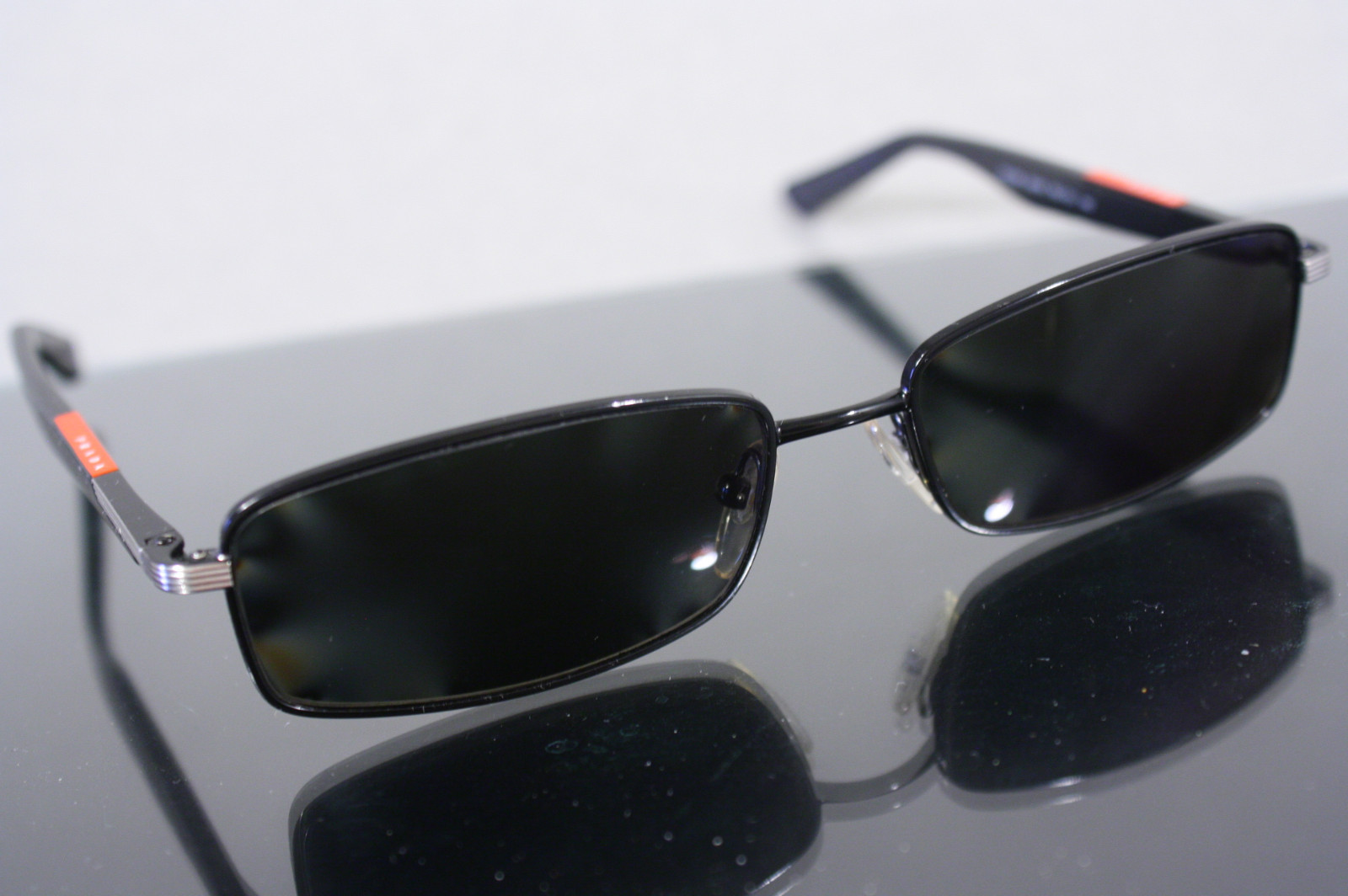 Prada VPS54B Eyeglasses Frame with Polarised prescription lenses R -0.5; L -0.25