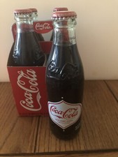 Coca Cola 4 pack - 2008 limited holiday edition - circa 1900 bottle Embossed