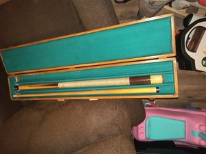 pre owned huebler pool cues with wooden case