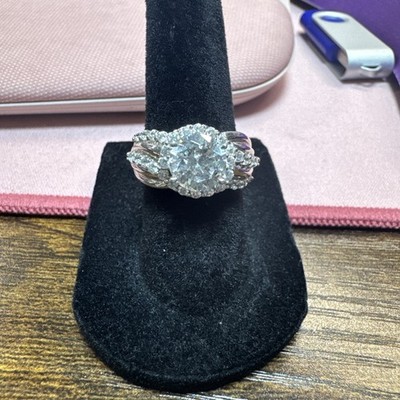 Silver Ring With Center CZ Surrounded In A Swirl Pattern By Smaller CZs Size 6