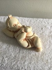 1940s Chalkware Baby Wall Plaque 4.5" Laying On Blue Pillow With Right Foot Up