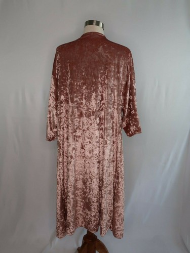 Rose gold pink velvet cover up jacket with long sleeves and back, displayed on mannequin against plain white background.