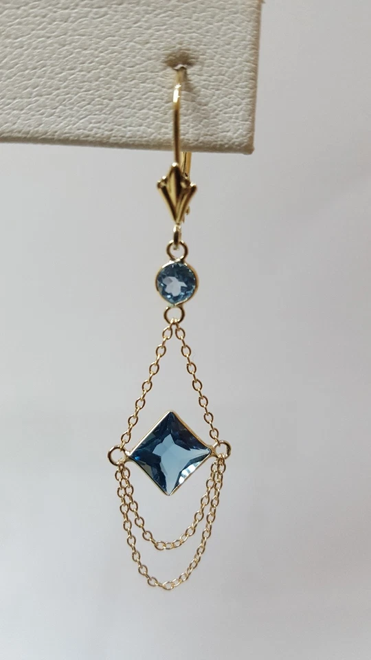 Pendientes de oro amarillo de 14k con piedra de topacio azul. Foto 2 de 4