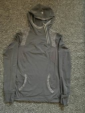 Women’s Lululemon grey asymmetric quarter zip gym hooded jacket. Size US 8 UK 12