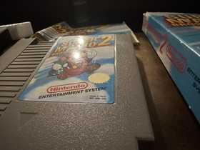 Carro Super Mario Bros 2 NES casi nuevo, caja sello ovalado caja Rev-A y manual (Dmg)