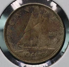 1964 circulated .800 silver Canadian 10 cents with reverse toning.