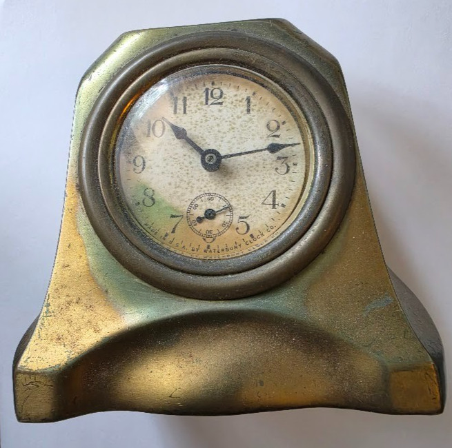 A tested, working antique Waterbury cast-brass desk clock with a sub-second dial — a piece of American horological history that ticks on your desk today.