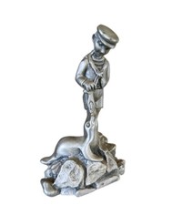 Vintage James Jewelers Pewter Figurine Boy with Seal 1982. Made In USA