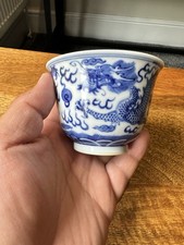 a 19th century chinese blue and white dragon tea bowl