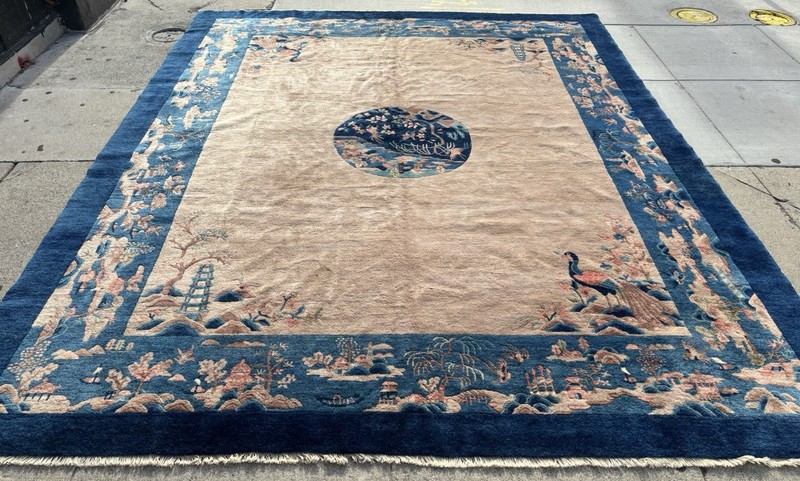 AN  ANTIQUE CHINESE RUG 9’9” X 8’2”