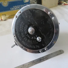 FISHING REEL PENN NO. 49 CONVENTIONAL DEEP SEA WITH A ROD CLAMP. CLEAN CHROME