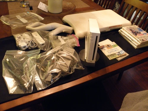 WII SYSTEM WITH EXTRAS LOOK ,HARDLY USED