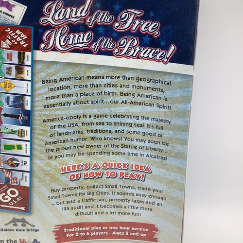 America-Opoly board game box with red/white flag, “Land of the Free,” “Home of the Brave,” and colorful game board.