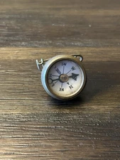 Marble's Gladstone Michigan brass compass pin back